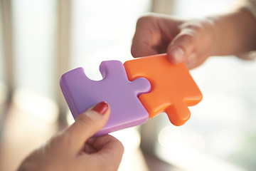 Image showing business people group assembling jigsaw puzzle