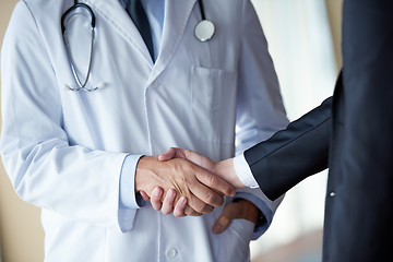 Image showing doctor handshake with a patient