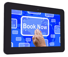 Image showing Book Now Tablet Touch Screen Shows Hotel Or Flights Reservation