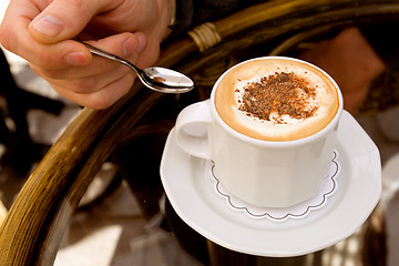 Image showing Drinking capuccino