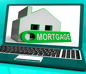 Image showing Mortgage House Laptop Shows Owing Money For Property