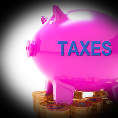 Image showing Taxes Piggy Bank Coins Means Taxed Income And Tax Rate
