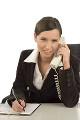 Image showing Businesswoman taking notes