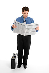 Image showing Businessman reading newspaper