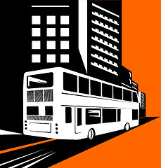 Image showing Double decker bus with buildings