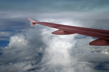 Image showing Cumulonimbus and pink wing