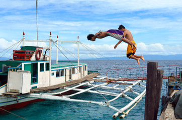 Image showing Diving Asian boys in port