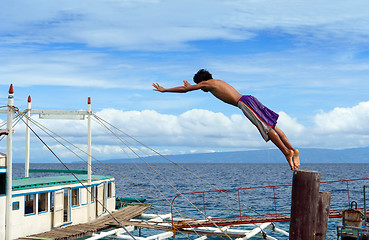 Image showing Diving Asian boy in port