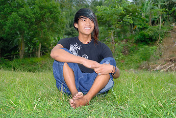 Image showing Asian punk teenager on lawn