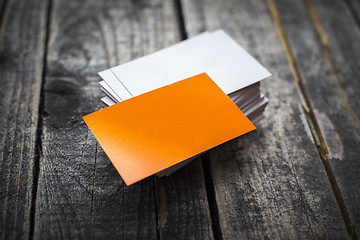 Image showing Orange business card identity mockup on wood