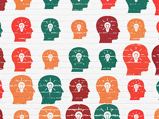 Image showing Advertising concept: Head With Light Bulb icons on wall background