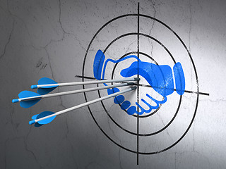 Image showing Business concept: arrows in Handshake target on wall background