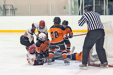 Image showing Skirmish at gate in children ice-hockey