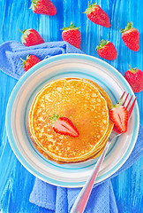 Image showing pancakes on plate and fresh strawberries