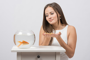 Image showing She asks goldfish fulfill the desire