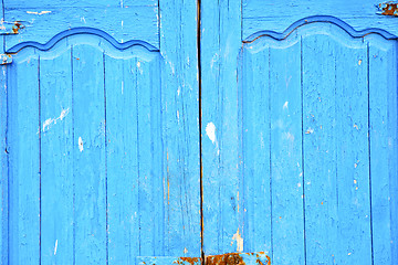 Image showing dirty stripped paint in the blue wood door  