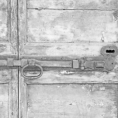 Image showing europe old in  italy  antique close brown door and rusty lock  c