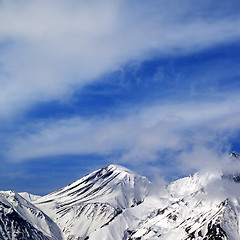 Image showing Winter snowy mountains and sky with clouds at nice day