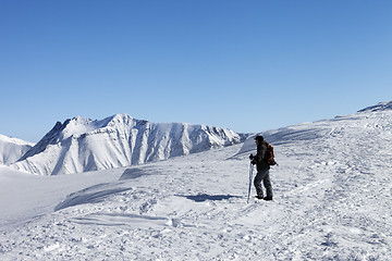 Image showing Skier on top of ski slope at nice morning