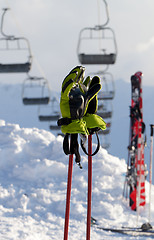 Image showing Gloves on ski poles at ski resort 