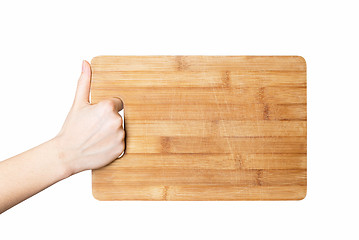 Image showing hand holding chopping board