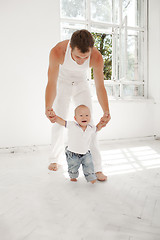 Image showing young father with his nine months old son at home