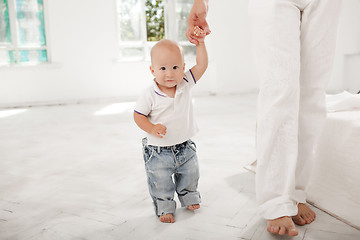 Image showing young father with his nine months old son at home