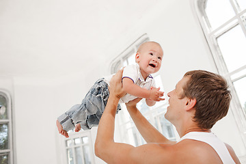 Image showing young father with his nine months old son at home