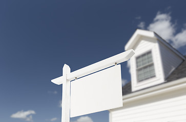 Image showing Blank Real Estate Sign in Front of New House 