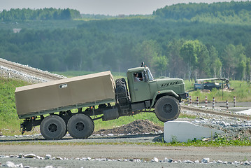 Image showing URAL truck comes through on high obstacle