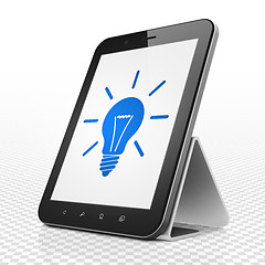 Image showing Finance concept: Tablet Computer with Light Bulb on display