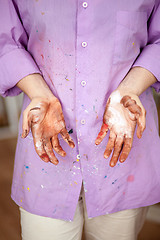 Image showing The girl with painted hands