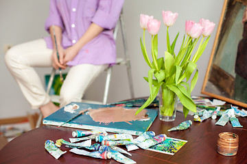 Image showing Artist\'s  palette close-up on the background of hands