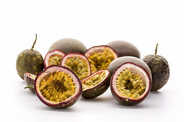 Image showing Flesh Of Halved Passionfruits In Their Hard Rind