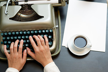 Image showing closeup of coffee and hands writing