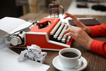 Image showing Side view of typewriter on desk