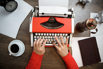 Image showing Vintage red typewriter with blank paper