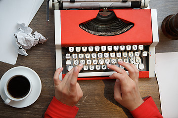 Image showing Hands on typing machine