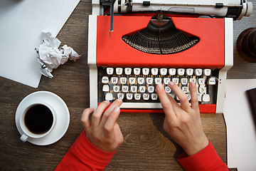 Image showing Hands on typing machine