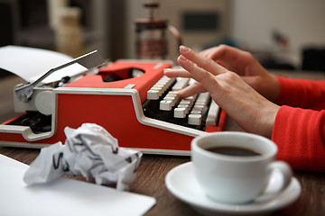 Image showing Side view of typewriter on desk