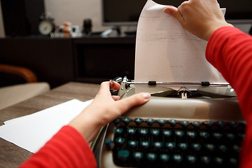 Image showing woman working on typewriter