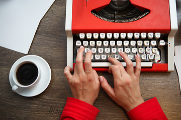 Image showing Hands on typing machine