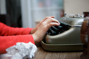 Image showing Hands of a man typing on typewriter