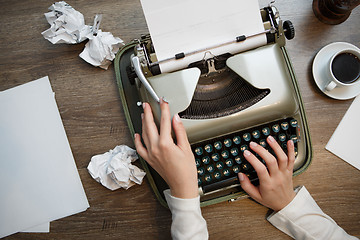 Image showing Vintage typewriter and white paper