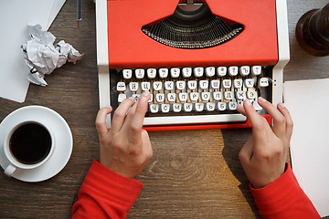 Image showing Hands on typing machine