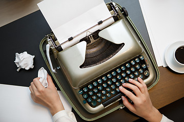 Image showing Vintage typewriter and white paper