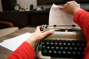 Image showing woman working on typewriter