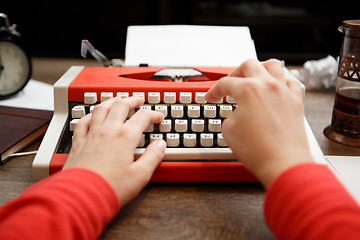 Image showing Vintage red typewriter with blank paper