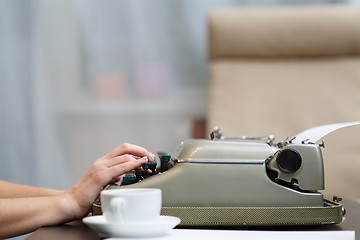 Image showing Hands writing on typewriter