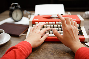 Image showing Vintage red typewriter with blank paper